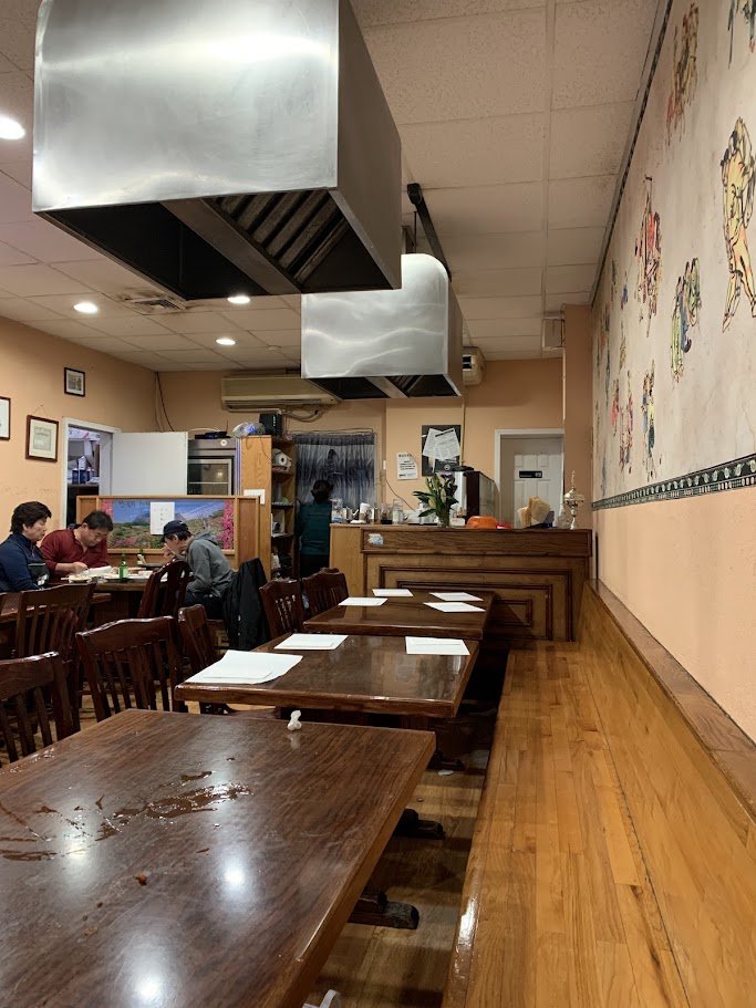 Warm dining room with seating for groups.